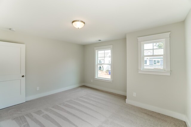 2023 Seneca Dr Lot 32, Raleigh, NC 27604 - unfurnished room featuring a wealth of natural light and carpet floors