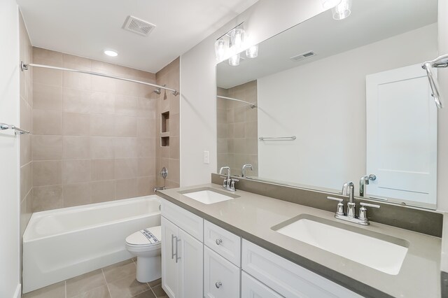 2023 Seneca Dr Lot 32, Raleigh, NC 27604 - full bathroom featuring tiled shower / bath combo, tile flooring, toilet, and double sink vanity