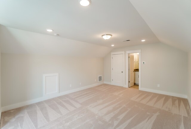 2023 Seneca Dr Lot 32, Raleigh, NC 27604 - additional living space featuring light carpet and vaulted ceiling