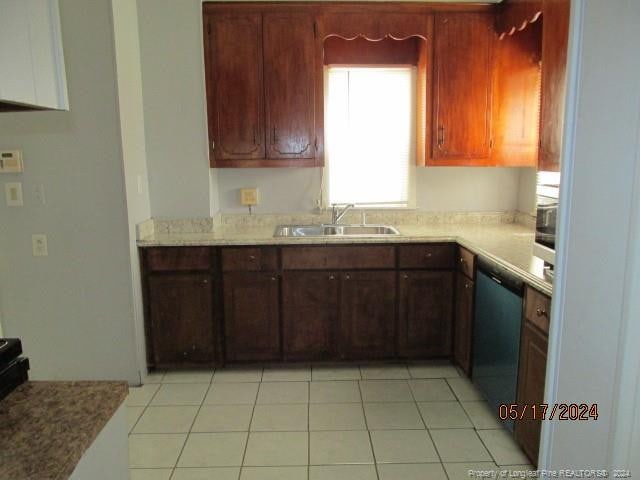 607 Carthage Rd, Lumberton, NC 28358 - kitchen with sink, dishwasher, and light tile floors