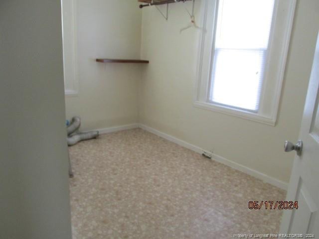607 Carthage Rd, Lumberton, NC 28358 - clothes washing area with carpet