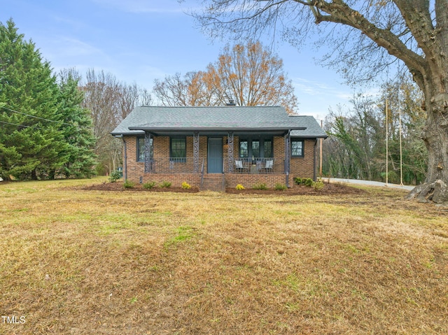 view of front of house featuring a porch and a front lawn