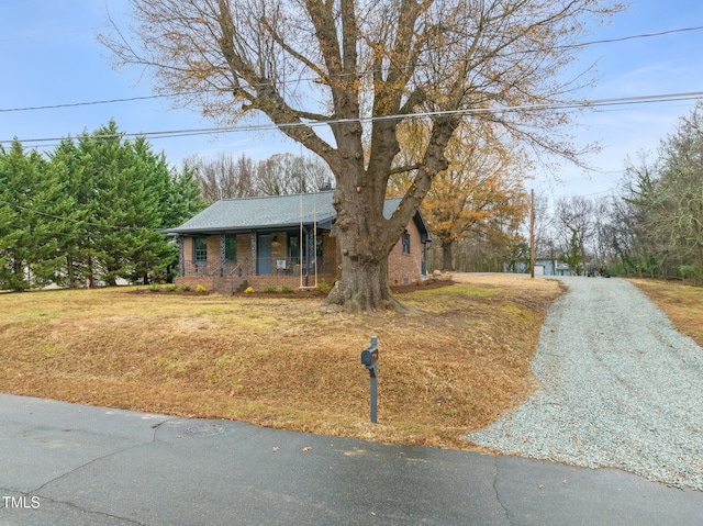 ranch-style house featuring a porch