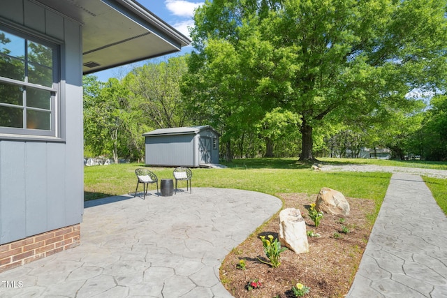 view of patio / terrace with an outbuilding and a storage shed