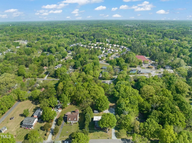 bird's eye view featuring a wooded view