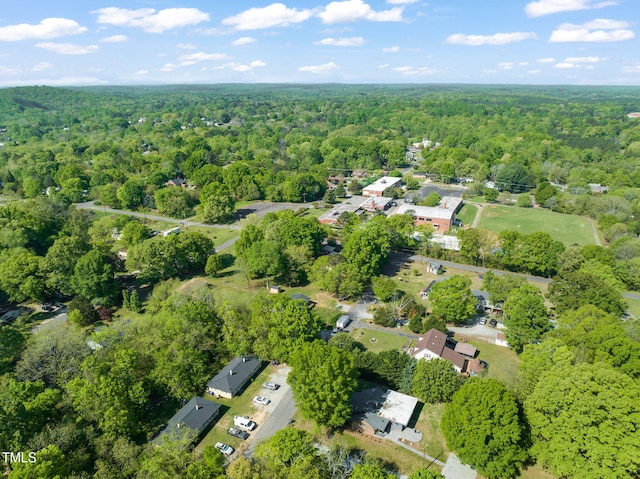 aerial view featuring a wooded view