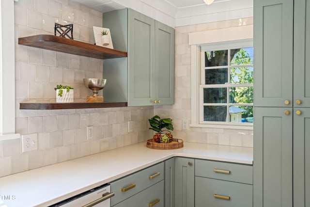 kitchen with green cabinetry, open shelves, and tasteful backsplash