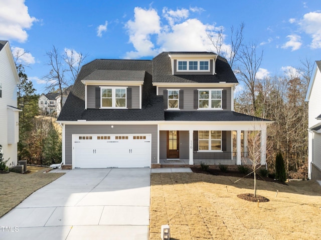 view of front of house with a porch and a garage