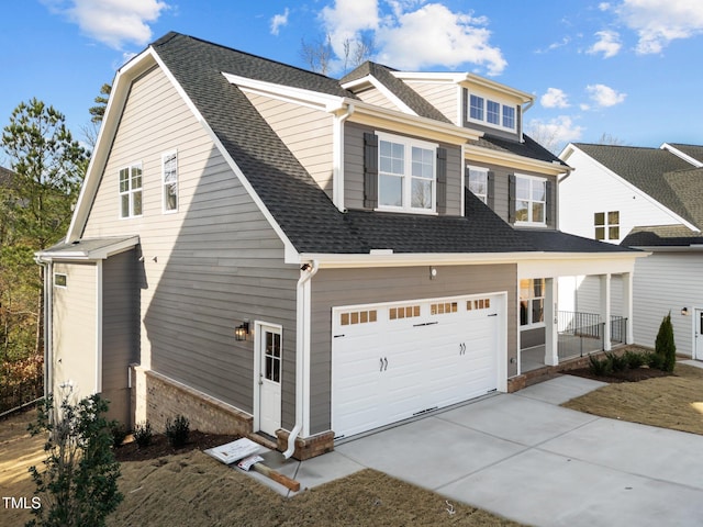 view of front of home with a porch and a garage