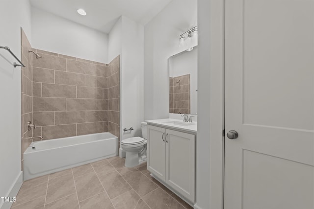 full bathroom with vanity, tiled shower / bath combo, toilet, and tile patterned flooring