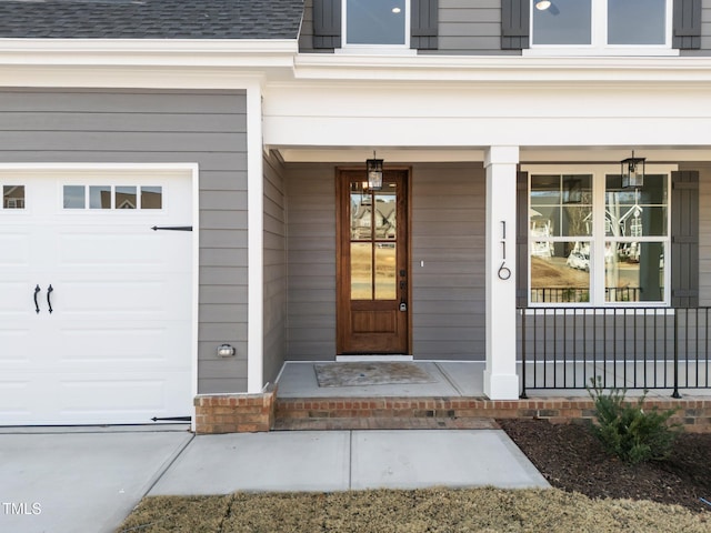 view of exterior entry with covered porch