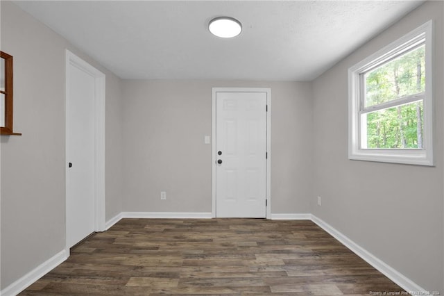 spare room featuring dark hardwood / wood-style floors