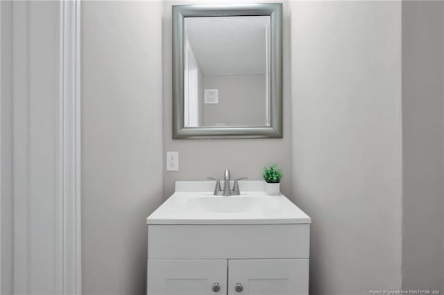 bathroom with vanity with extensive cabinet space