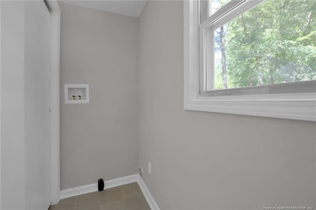 laundry area featuring tile flooring and washer hookup