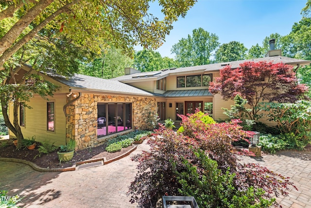 back of house with a patio area