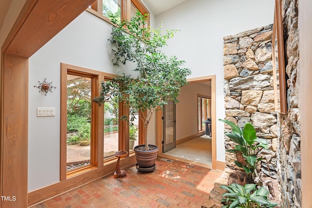 entryway with a towering ceiling