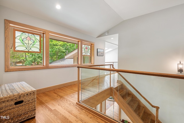 interior space featuring vaulted ceiling and light hardwood / wood-style flooring