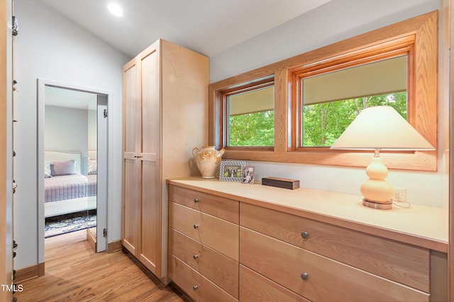 hall with light hardwood / wood-style flooring