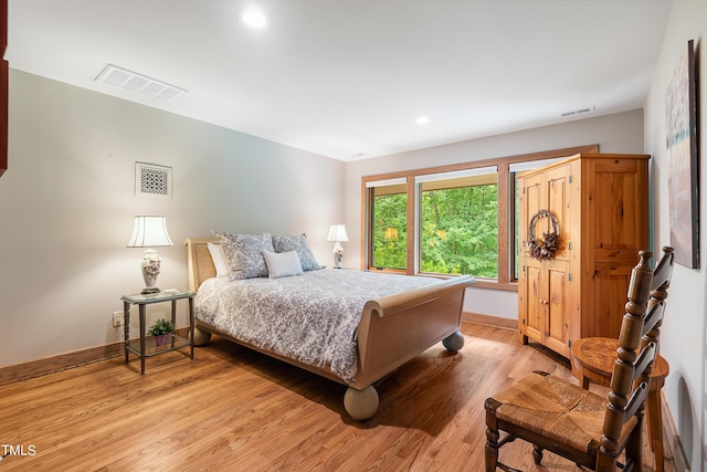 bedroom with light hardwood / wood-style floors