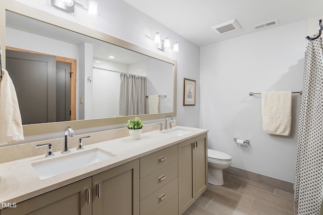 bathroom featuring vanity, tile patterned floors, toilet, and a shower with shower curtain