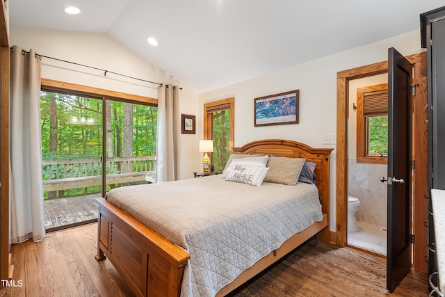 bedroom featuring lofted ceiling, dark hardwood / wood-style floors, connected bathroom, and access to exterior