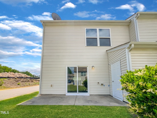 rear view of house featuring a patio