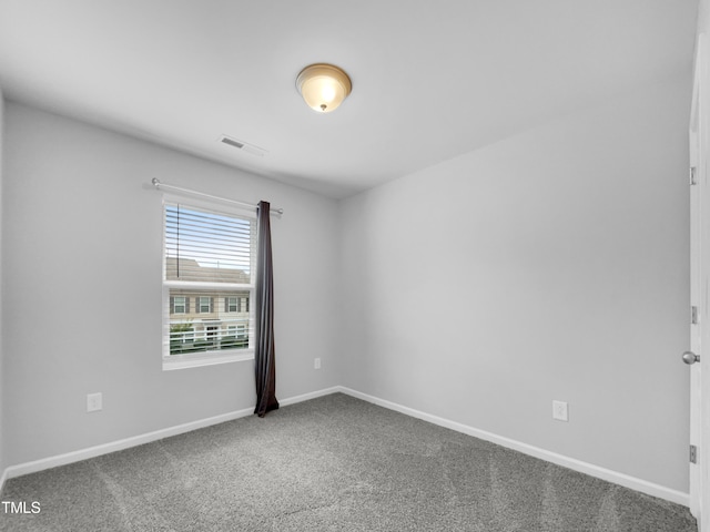 empty room with carpet flooring