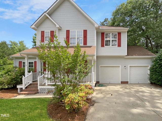 view of front facade featuring covered porch and a garage