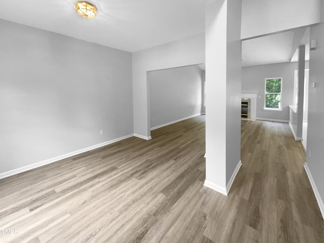 unfurnished living room featuring wood-type flooring