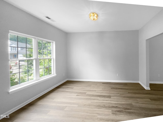 empty room with light hardwood / wood-style floors