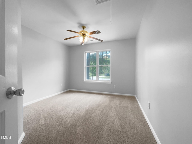 carpeted empty room featuring ceiling fan