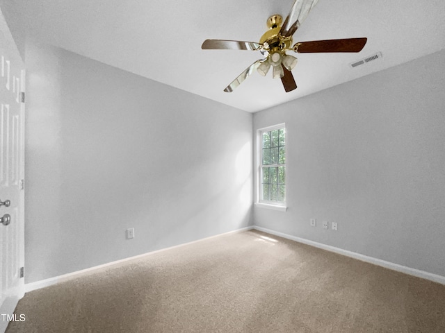 spare room with carpet and ceiling fan