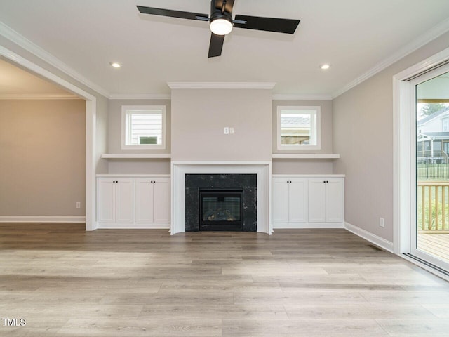 unfurnished living room featuring crown molding and light hardwood / wood-style flooring