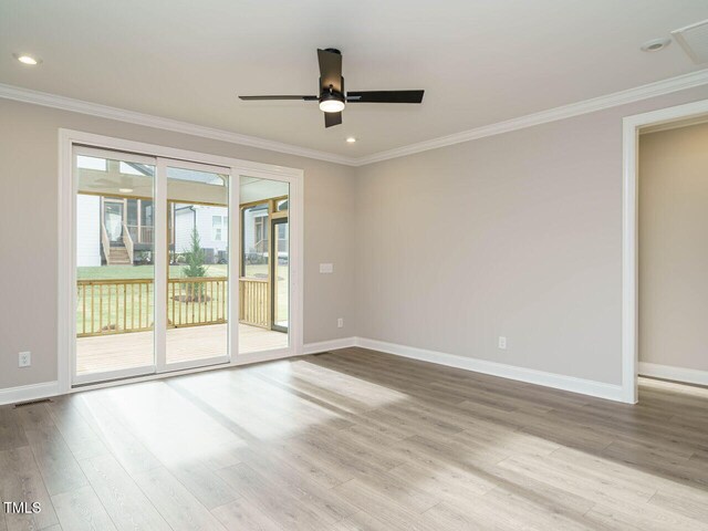 unfurnished room featuring light hardwood / wood-style floors, ceiling fan, and crown molding