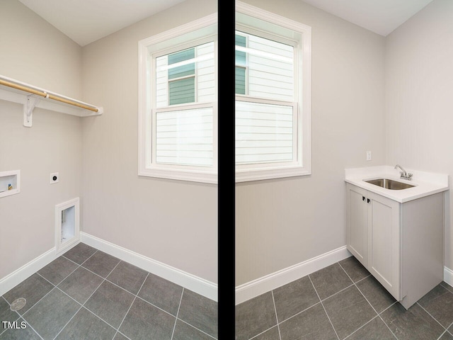 laundry area featuring cabinets, dark tile patterned flooring, sink, washer hookup, and hookup for an electric dryer