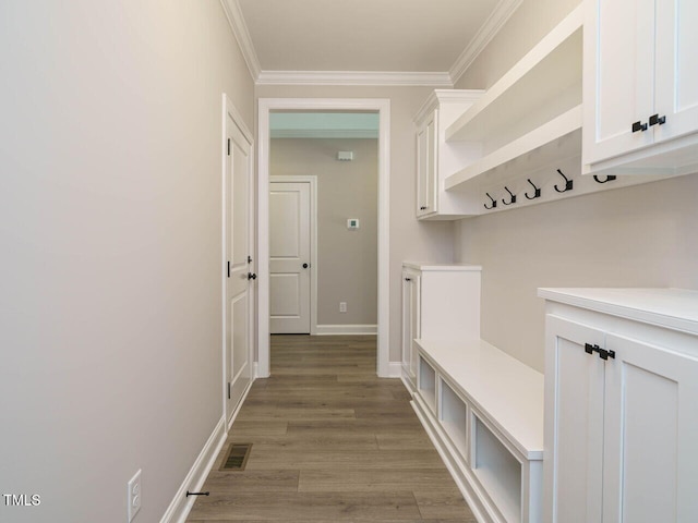 mudroom with crown molding and light hardwood / wood-style flooring