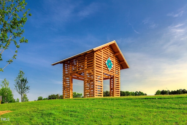 exterior space with a rural view and a lawn