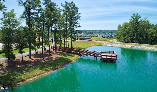 view of swimming pool with a water view