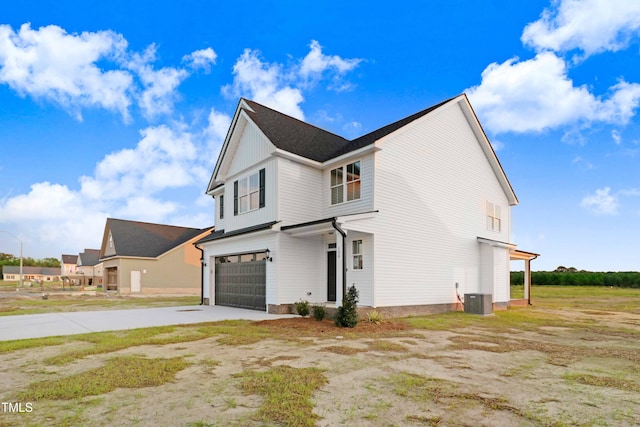 view of side of home featuring a garage and central air condition unit