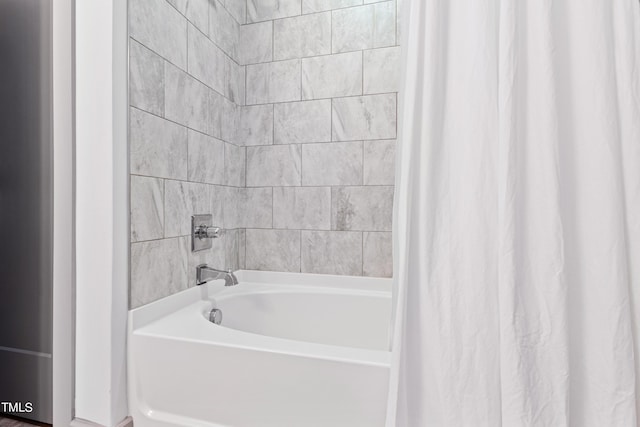 bathroom with shower / bathtub combination with curtain