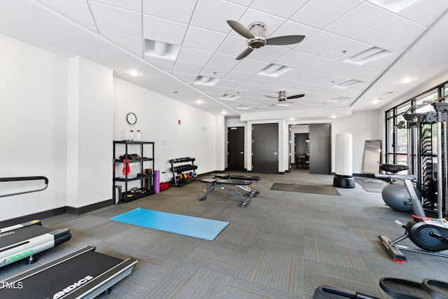 gym featuring carpet floors and a paneled ceiling