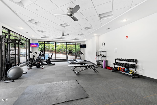 exercise room with ceiling fan