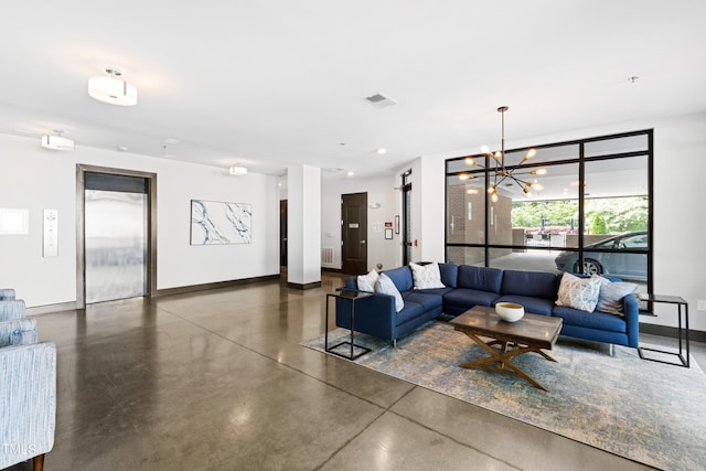 living room featuring elevator and a notable chandelier