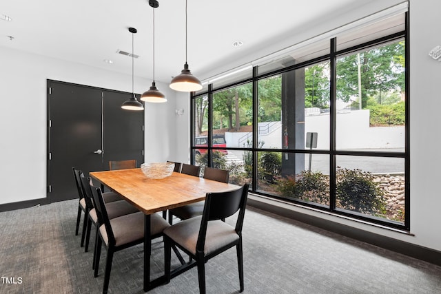 view of carpeted dining space