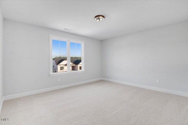 unfurnished room featuring carpet flooring