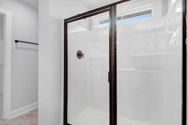 bathroom featuring an enclosed shower