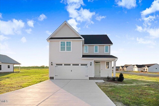 view of front of house with a garage and a front yard