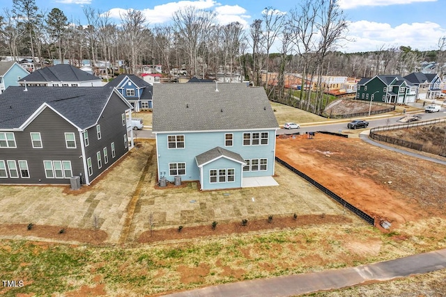 birds eye view of property with a residential view