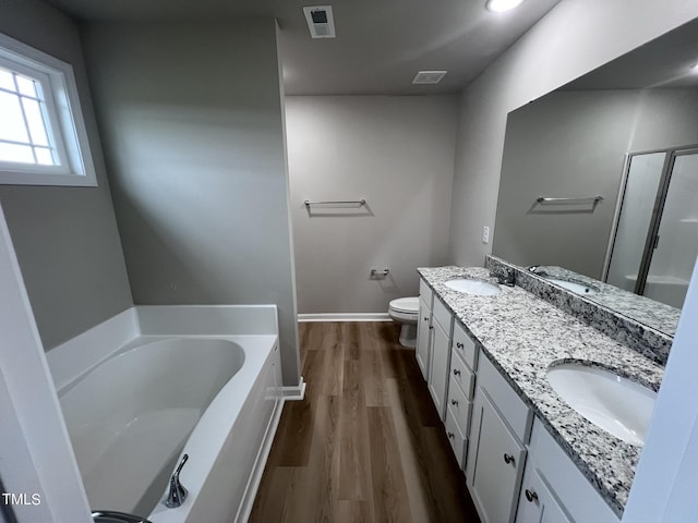 full bathroom with a bath, visible vents, and a sink