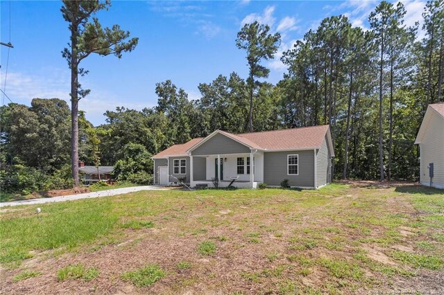 view of front of house with a front lawn and covered porch